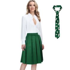 a woman wearing a white shirt and green pleated skirt is standing next to a tie