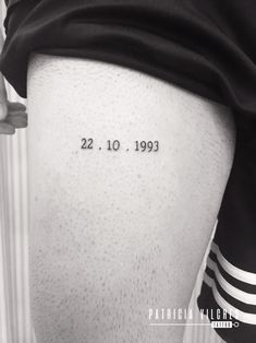 the back of a person's leg with numbers on it