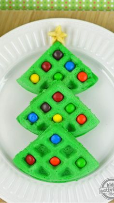 a green christmas tree shaped waffle cake on a white plate