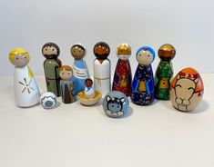 a group of wooden dolls sitting next to each other