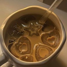 a cup filled with liquid sitting on top of a counter