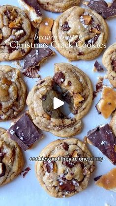 chocolate chip cookies are arranged on a white surface