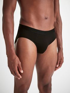 Our mid-height brief has a closed front for a clean and classic look. We chose a super-soft binding to finish the hems; all part of our quest for a minimalist streamlined look and the ultimate in softness and comfort. Crafted from a unique blend of 92% Pima cotton and 8% elastane for added stretch, they're the perfect feel-good choice for sleeping, lounging and day-to-day wear. The model is 6'2" / 189cm tall. He wears a size Medium. Modern Black Smoothing Bottoms, Classic Seamless No-show Bottoms, Classic Stretch Bottoms With Moderate Coverage, Classic Soft Touch Bottoms, Derek Rose, Men's Briefs, Black Jersey, Black Pattern, Pima Cotton