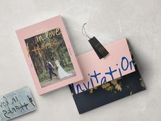 a couple's wedding photo and save the date magnets are on top of each other