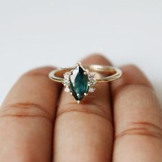 Pretty and simple Teal Sapphire diamond engagement ring. The stones can also be of other shape or kind.Gorgeous Marquise Teal Sapphire Diamond Ring, Stackable Beautiful Ring, Delicate Gemstone Ring, Wedding/Engagement Beautiful Jewelry.Product info:Main gemstone: Teal SapphireShape: Marquise Measurements: approx. 10*5 mmSide stones: white diamondsShape: roundMeasurements: approx. 1.5 mmQuality: I-J color, SI clarity, conflict-freeItem will be resized and shipped within 10 days.ITEM Will BE SHIPP Marquise-shaped Emerald Rings For Weddings, Marquise Emerald Rings For Wedding, Wedding Emerald Marquise Rings, May Birthstone Wedding Ring In Marquise Cut, May Birthstone Marquise Ring For Wedding, Oval Topaz Ring For Wedding, May Birthstone, Green Oval Topaz Ring For Wedding, Marquise Sapphire Wedding Ring As Birthstone, Emerald Crystal Wedding Ring With Ethical Gemstones