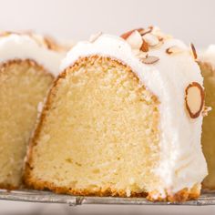 a cake with white frosting and nuts on top