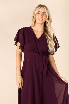 Timelessly elegant, this chiffon maxi dress pairs a wrapped bodice with soft flutter sleeves and a flowy skirt that make a perfect combination for this flattering dress. Short flutter sleeves - lined to the cap sleeve length Self fabric tie belt Fully lined Maternity and nursing friendly Fabric content - Polyester - Dry clean recommended To order this dress, please go to https://arborandco.com/ Chic Chiffon Flowy Wrap Dress, Chic Flowy Chiffon Wrap Dress, Flowy Chiffon Dress With Tie Waist, Elegant Flowy Faux Wrap Maxi Dress, Flowy Chiffon Maxi Dress With Tie Waist, Flowy Flutter Sleeve Dress With Tie Waist, Elegant Flowy Maxi Dress With Butterfly Sleeves, Flowy Wrap Dress With Ruffles And Flutter Sleeves, Flowy Wrap Dress With Flutter Sleeves And Ruffles