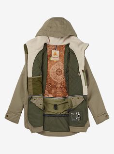 an image of a jacket that is green and brown with patches on the front, zippers at the back