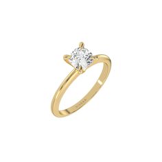 a yellow gold ring with a single diamond