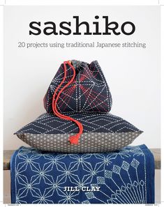 two bags sitting on top of each other with the title sashiko written in japanese