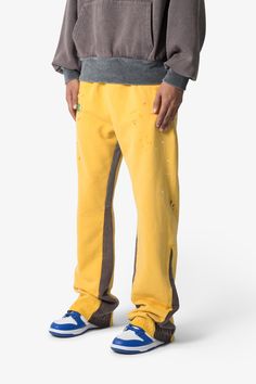 the Contrast Bootcut Sweatpants are designed with a relaxed fit throughout, featuring an elasticized self waist and leg opening, multi-colored paint splatter throughout, and finished with denim and contrasting panels at the inseam and outseam to provide a flare at the leg opening. details relaxed fit flared leg opening 100% cotton model is 6’1, 140 lbs and wears a size medium Spring Straight Leg Color Block Pants, Spring Color Block Straight Leg Pants, Color Block Straight Leg Cotton Pants, Streetwear Cotton Pants With Contrast Color, Streetwear Yellow Pants With Elastic Waistband, Color Block Cotton Straight Leg Pants, Streetwear Bottoms With Contrast Color And Long Pants, Streetwear Color Block Cotton Bottoms, Yellow Pants With Elastic Waistband For Streetwear