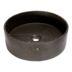 a round black metal object on a white background