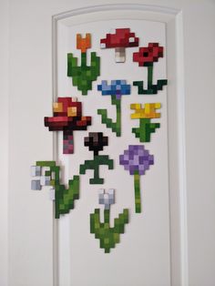 a white door with some pixelated flowers on it