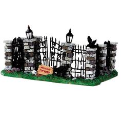 a model of a brick fence and gate with a sign that says welcome to the cemetery