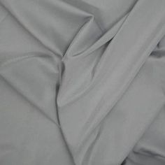 a close up view of a plain grey fabric