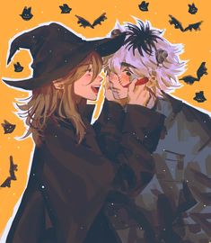 two people dressed up as witches and bats, one holding the other's head