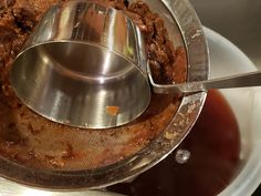 a food processor with meat in it on top of a table