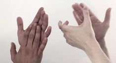 two hands reaching out towards each other