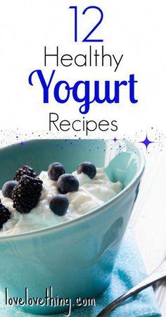 a blue bowl filled with yogurt and berries on top of a blue towel