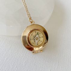 "Introducing the timeless and classic gold compass locket - a stunning addition to your jewelry collection. Crafted from smooth gold plated brass, this locket measures 27mm in diameter and has a magnetic working compass set into the front. The brass compass features a delicate glass face and adds an extra touch of elegance to this already beautiful piece. This piece is lightweight with a delicate chain. The locket opens to reveal a secret place to keep pictures, messages, or any small trinkets t Compass Locket Necklace, Mens Locket, Compass Locket, Mel Aesthetic, Goblin Mode, Locket Necklaces, Compass Jewelry, Necklace Locket, Secret Place