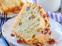 a close up of a slice of cake on a plate with a fork next to it