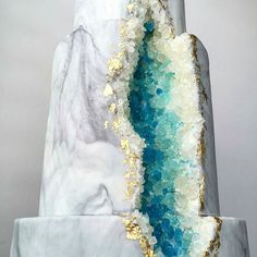 an image of a white marble sculpture with blue and gold accents