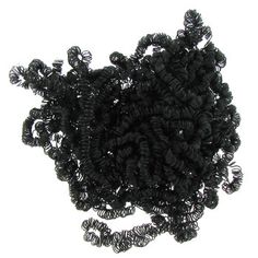 a pile of black spirals sitting on top of each other in front of a white background