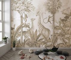 a room with wallpaper that has giraffes and palm trees on it