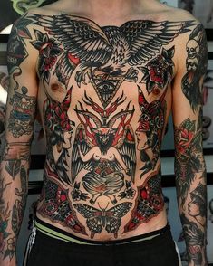 a man with lots of tattoos on his chest