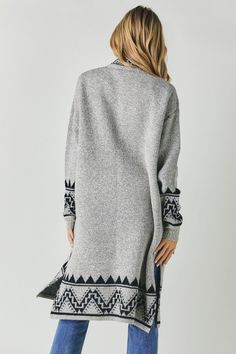 This Aztec-printed cardi is here to spice up your wardrobe for good. In a warm blend perfect for transitional weather, this longline cardigan provides stylish coverage without sacrificing comfort. Pops of color woven throughout give this layer a boho vibe, while oversized pockets offer a place to stash your essentials on the go. Side slits allow for effortless movement. Slip this versatile piece on over a simple tee and jeans for a casual weekend look or a floral dress for a night out. However y Fall Jacquard Knit Cardigan For Layering, Fair Isle Sweater Coat For Fall, Jacquard Knit Cardigan For Layering, Cozy Fair Isle Cardigan For Fall, Cozy Fair Isle Pattern Cardigan For Fall, Cozy Jacquard Knit Cardigan For Fall, Casual Jacquard Knit Sweater Coat For Fall, Winter Outerwear With Fair Isle Pattern For Layering, Cozy Fair Isle Sweater Coat For Fall