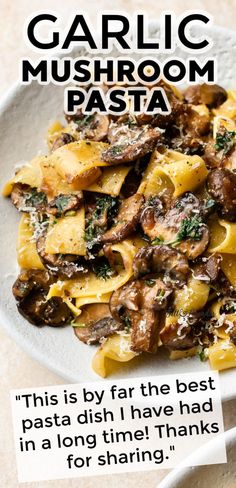 a white plate topped with pasta covered in mushrooms