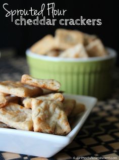 a white plate topped with crackers on top of a table