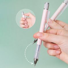 a person holding a pen and pointing at it with their thumbnails in the other hand