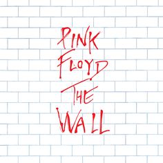 the words pink floyd and the wall are spray painted red on a white brick wall