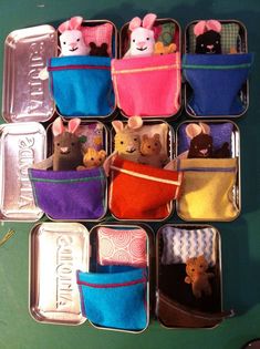 there are many small stuffed animals in the pocket on this tray, each with different colors and sizes