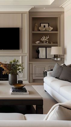 a living room filled with furniture and a flat screen tv mounted on the wall above a fireplace