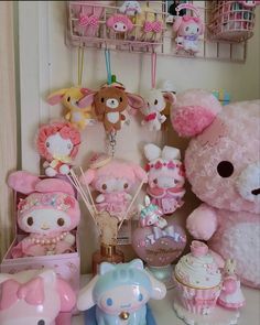 there are many stuffed animals and toys on the shelf in front of the door, including a pink teddy bear