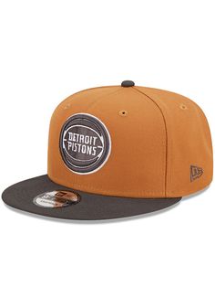 the detroit pistons new era snapback hat is shown in brown and black, with an embroidered patch on the front