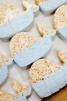 blue and white decorated cookies sitting on top of a table