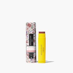 Yellow uncapped tube of Beekman 1802's Honeyed Grapefruit Sheer Tinted Lip Balm, standing next to packaging tube for lip balm thats covered in flowers, on a white background. Skin Care Quiz, Hand Creams, Holiday Gift Sets, Tinted Lip Balm, Linen Spray, Fragrance Gift, Pink Grapefruit, Lip Balms, Skincare Set