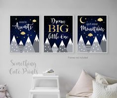 three posters with the words dream big little one and snow covered mountains are hanging in a child's bedroom