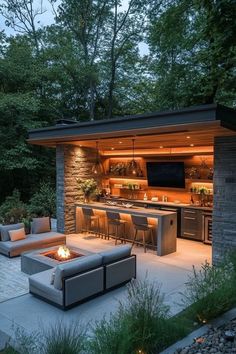 an outdoor living area with couches, tables and fire pit in the middle of it