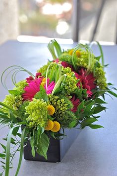 a bouquet of flowers sitting on top of a table