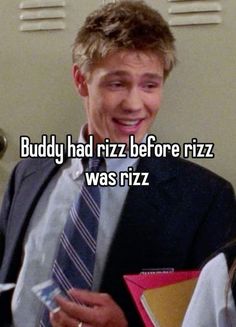 a man in a suit and tie holding a binder with the words buddy had riz before rizz was rizzi