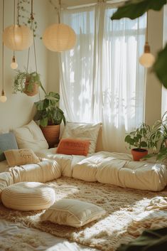 a living room filled with lots of plants and pillows on top of a rug covered floor