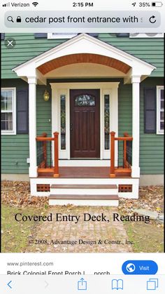 a green house with black shutters and white trim on the front door is covered entry deck, reading