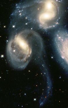 two spiral galaxy like objects in the sky