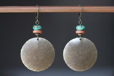 "These boho dangle earrings are made with antique brass discs that I hammered first, then to give more texture and character, I domed them. I added some brown earthy ceramic discs and some blue green brownish African turquoise beads on the top.  Color :  Blue green African turquoise stones Finish : Antiqued Brass disc round hammered and hand domed by myself  1\"1/4 ( 32 mm)  Size : 2\" 1/4 including the antiqued brass lever back For more choices on my brass boho earrings, please refer to the link below : https://www.etsy.com/shop/NtikArtJewelry?section_id=16059931 I usually ship between 1 and 3 business day with USPS. If you need an order sooner you can still select a priority mail at direct check out. I will do my best to send them out ASAP. I always ship in eco - friendly packages. Your Handmade Bohemian Round Disc Jewelry, Handmade Bohemian Disc Jewelry, Bohemian Handmade Round Disc Jewelry, Nickel-free Brass Earthy Earrings, Earthy Nickel-free Brass Earrings, Bohemian Festival Earrings With Patina, Bohemian Patina Earrings, Bohemian Nickel-free Round Disc Jewelry, Earthy Ceramics