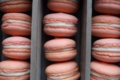 several pink macaroons are stacked on top of each other