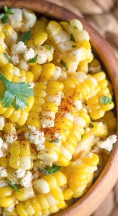 corn with herbs and seasoning in a bowl